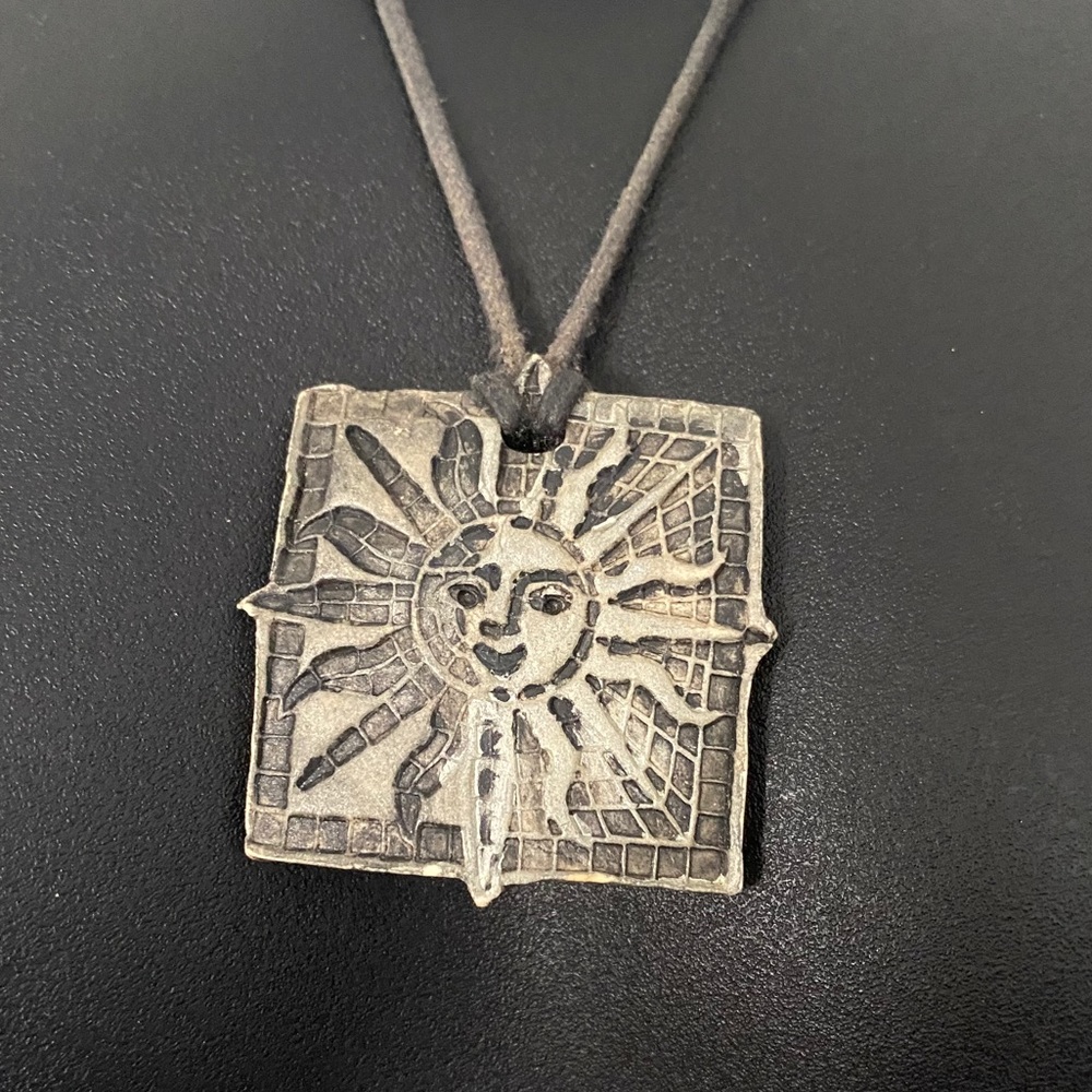 Sun necklace on black cord